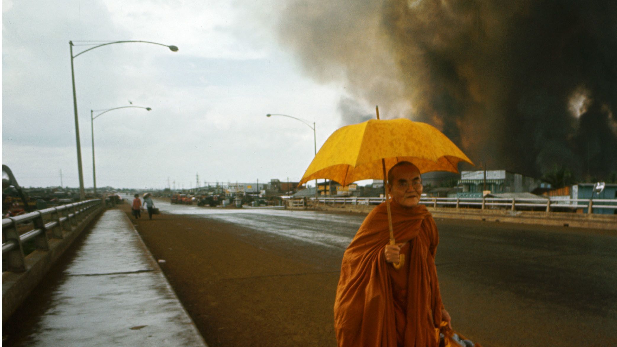 A Buddhist monk crossing a bridge in Saigon during Mini Tet in 1968. (Photo by Tim Page/Getty Images)