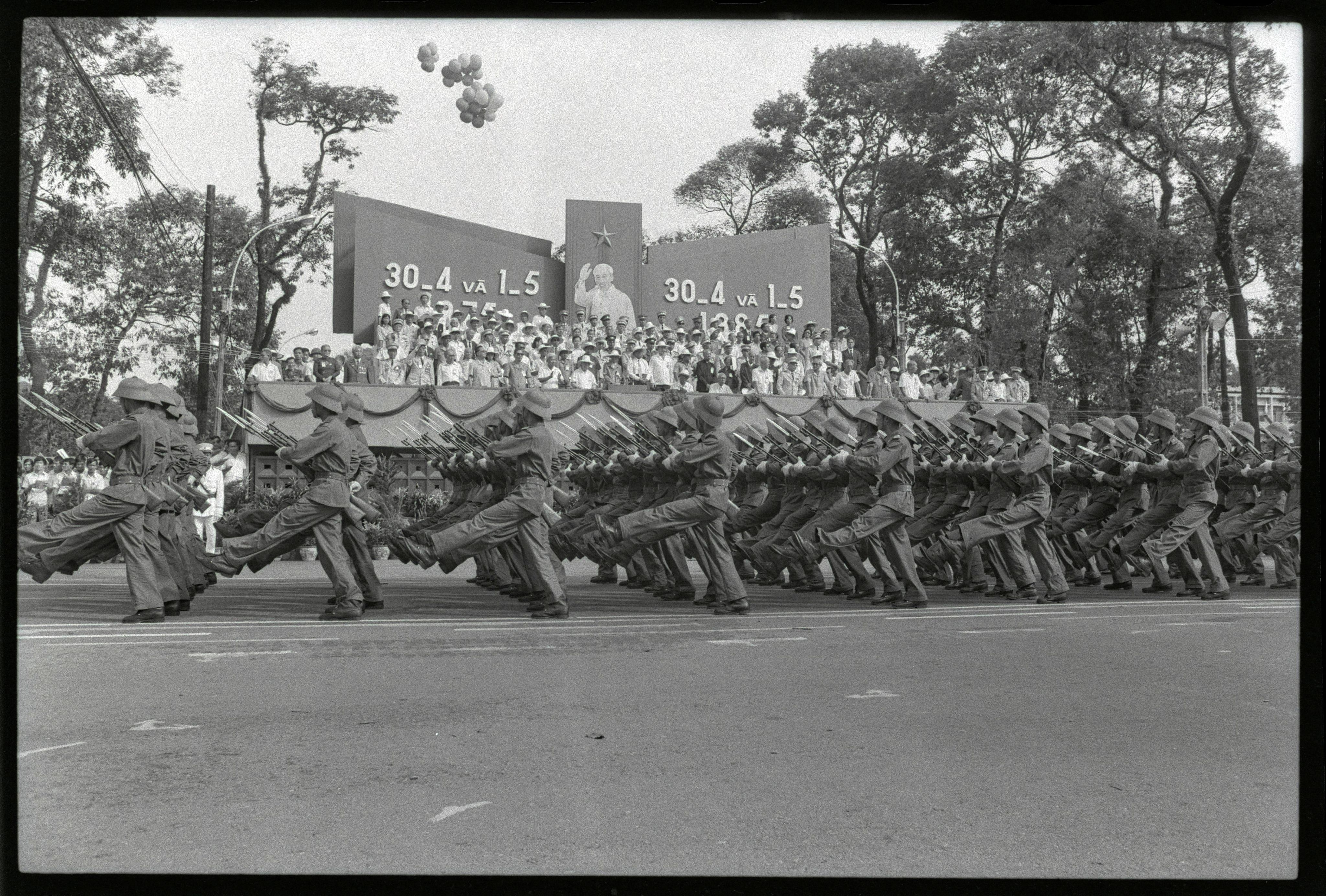 Vietnamese troops goose-step past the reviewing stand with large picture of Ho Chi Minh on it, during parade to celebrate the 10th anniversary of the fall of Saigon in Ho Chi Minh City. REUTERS/Pat Benic 85170096 ANNIVERSARY ARMY GOOSE STEP HO CHI MINHCITY PARADE POSTER&nbsp;VIETNAM; Ho Chi Minh DISCLAIMER: The image is presented in its original, uncropped, and untoned state. Due to the age and historical nature of the image, we recommend verifying all associated metadata, which was transferred from the index stored by the Bettmann Archives, and may be truncated.